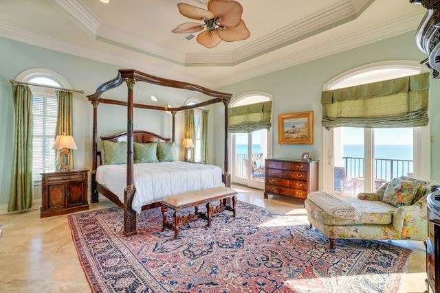 Master bedroom with canopy bed and ocean views